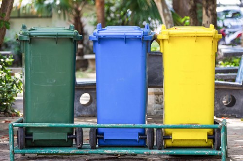 A Willesden street with skips and recycling bins representing sustainable skip hire