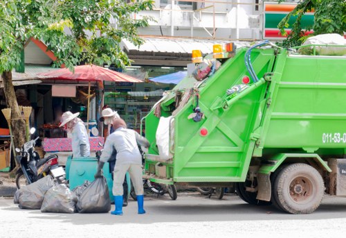 Workers removing demolition debris in Willesden
