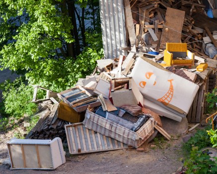Workers sorting materials at a local transfer station in northwest London